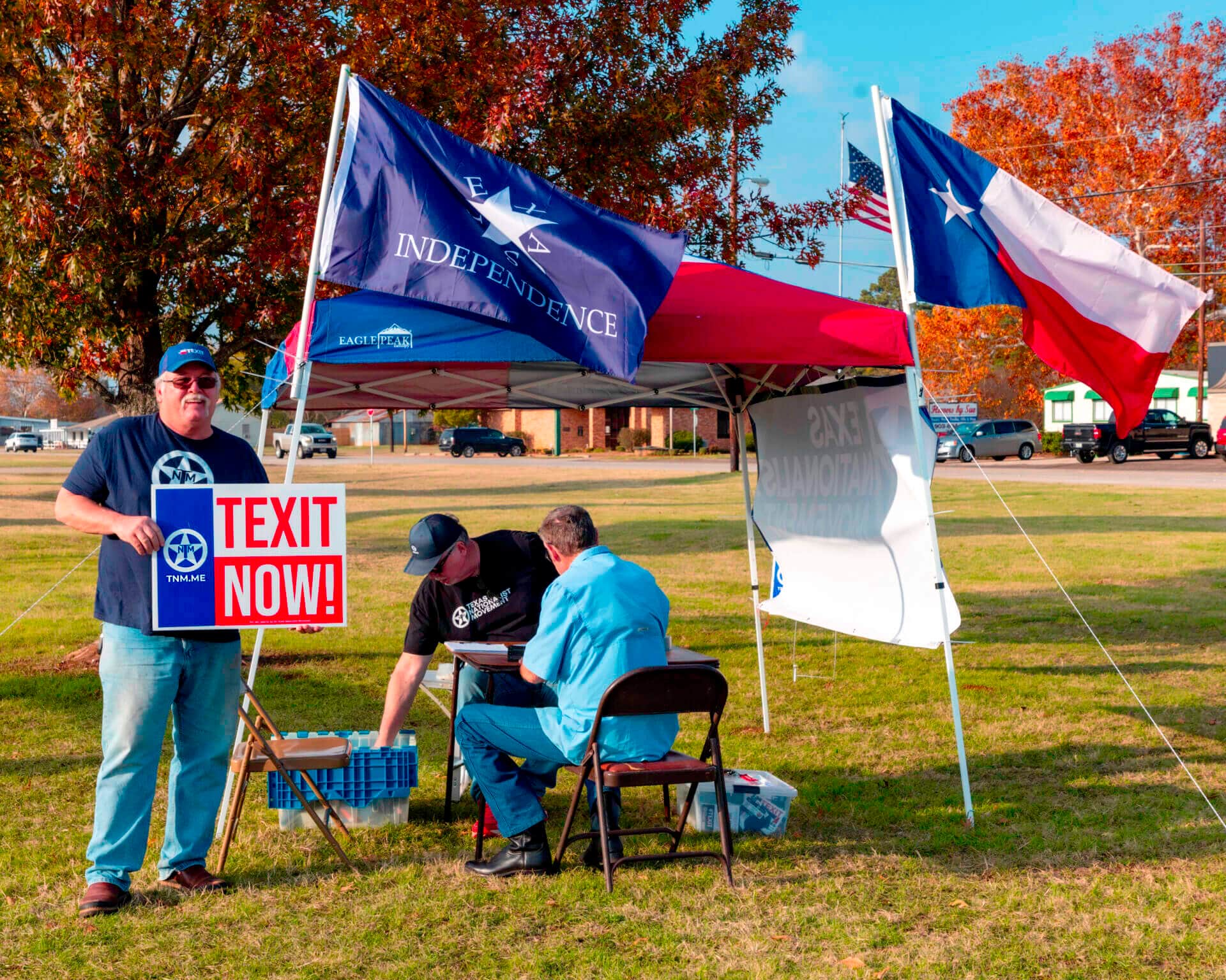 Texans organizing at a Texas Nationalist Movement booth in the field.