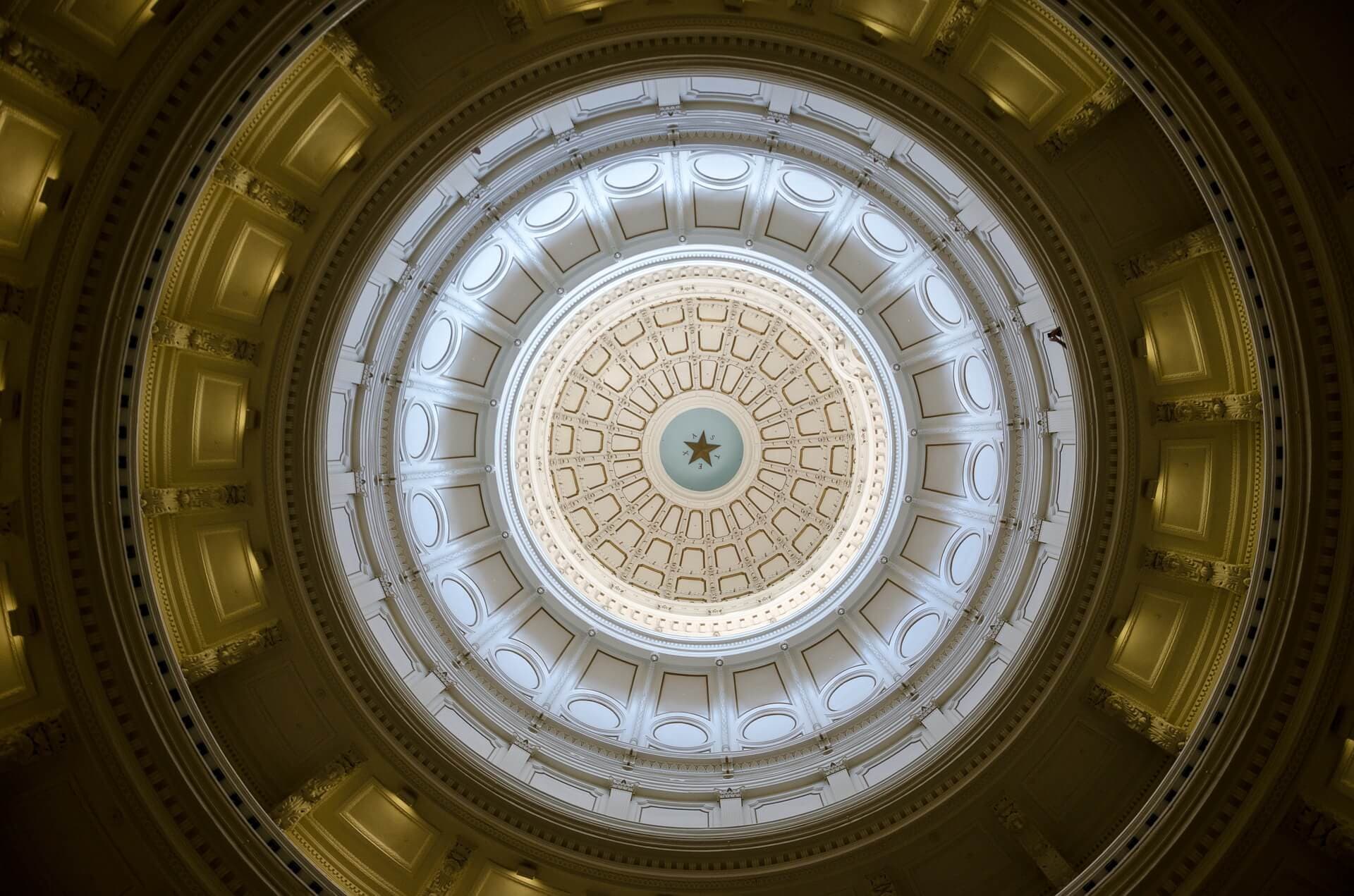The interior of the Texas State Capitol dome, the lone star at its center.