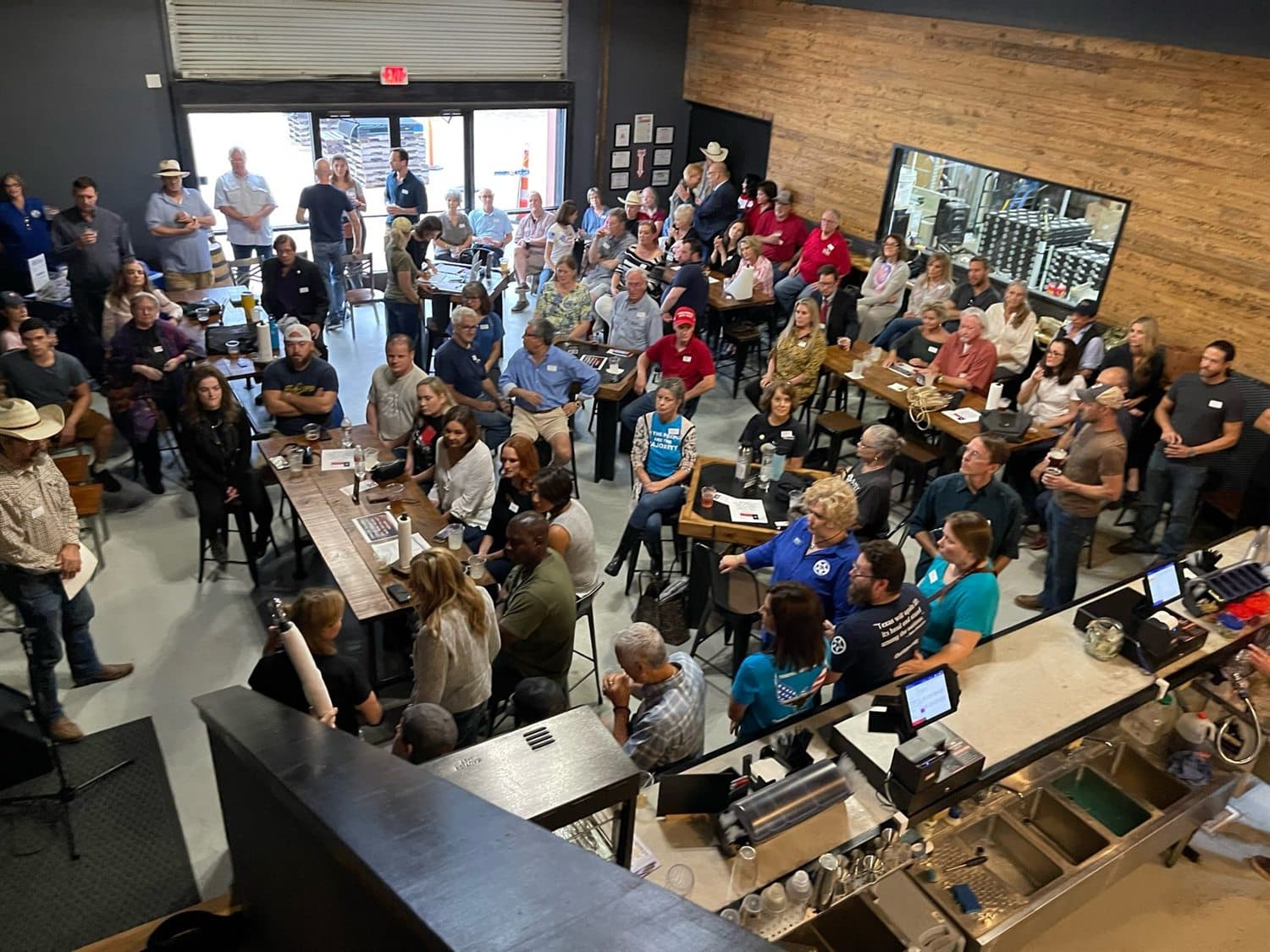 Texans gathered in a meeting room at a Texas Nationalist Movement event.