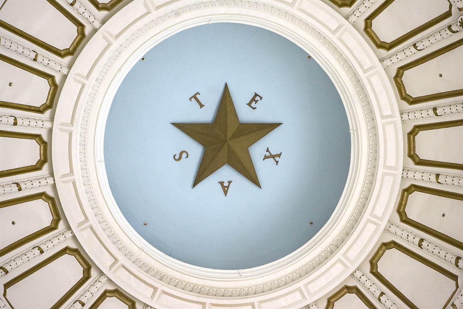 The lone star at the center of the Texas State Capitol dome.